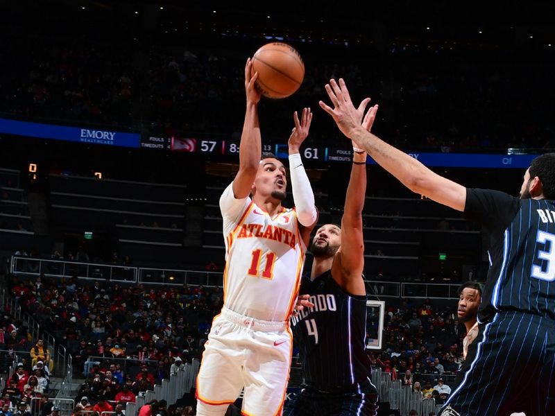 ATLANTA, GA - JANUARY 17: Trae Young #11 of the Atlanta Hawks goes to the basket during the game on January 17, 2024 at State Farm Arena in Atlanta, Georgia.  NOTE TO USER: User expressly acknowledges and agrees that, by downloading and/or using this Photograph, user is consenting to the terms and conditions of the Getty Images License Agreement. Mandatory Copyright Notice: Copyright 2024 NBAE (Photo by Scott Cunningham/NBAE via Getty Images)