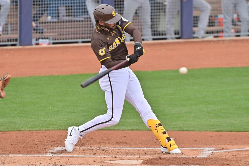 Feb 26, 2024; Peoria, Arizona, USA;  San Diego Padres right fielder Fernando Tatis Jr. (23) at bat in the first inning against the Cleveland Guardians during a spring training game at Peoria Sports Complex. Mandatory Credit: Matt Kartozian-USA TODAY Sports