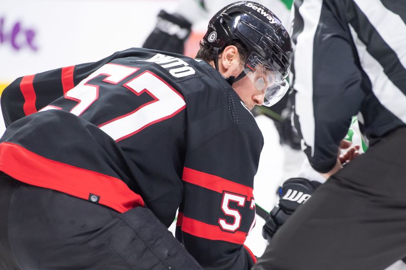 Feb 22, 2024; Ottawa, Ontario, CAN; Ottawa Senators center Shane Pinto (57) lines up for a faceoff in the second period against the Dallas Stars at the Canadian Tire Centre. Mandatory Credit: Marc DesRosiers-USA TODAY Sports