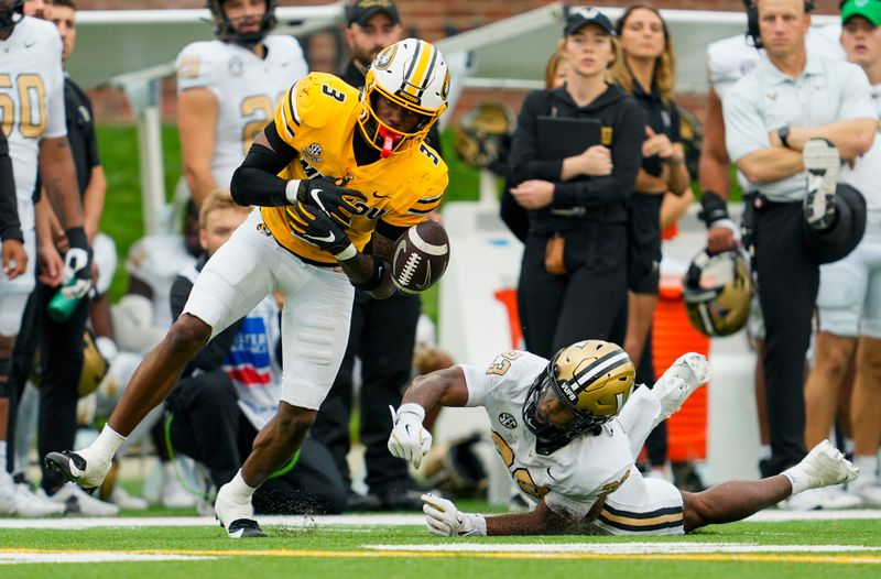 Sep 21, 2024; Columbia, Missouri, USA; Missouri Tigers safety Sidney Williams (3) breaks up a pass intended for Vanderbilt Commodores running back AJ Newberry (23) during the second half at Faurot Field at Memorial Stadium. Mandatory Credit: Jay Biggerstaff-Imagn Images