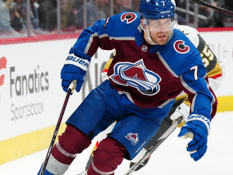 Jan 10, 2024; Denver, Colorado, USA; Colorado Avalanche defenseman Devon Toews (7) controls the puck in the first period against the Vegas Golden Knights at Ball Arena. Mandatory Credit: Ron Chenoy-USA TODAY Sports