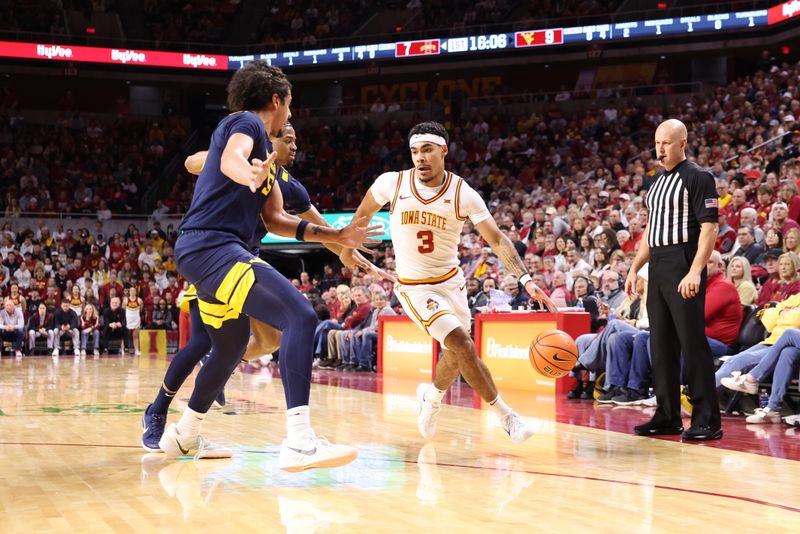 Jan 2, 2026; Ames, Iowa, USA; West Virginia Mountaineers center Harlan Obioha (55) defends Iowa State Cyclones guard Tamin Lipsey (3)  during the first half at James H. Hilton Coliseum. Mandatory Credit: Reese Strickland-Imagn Images