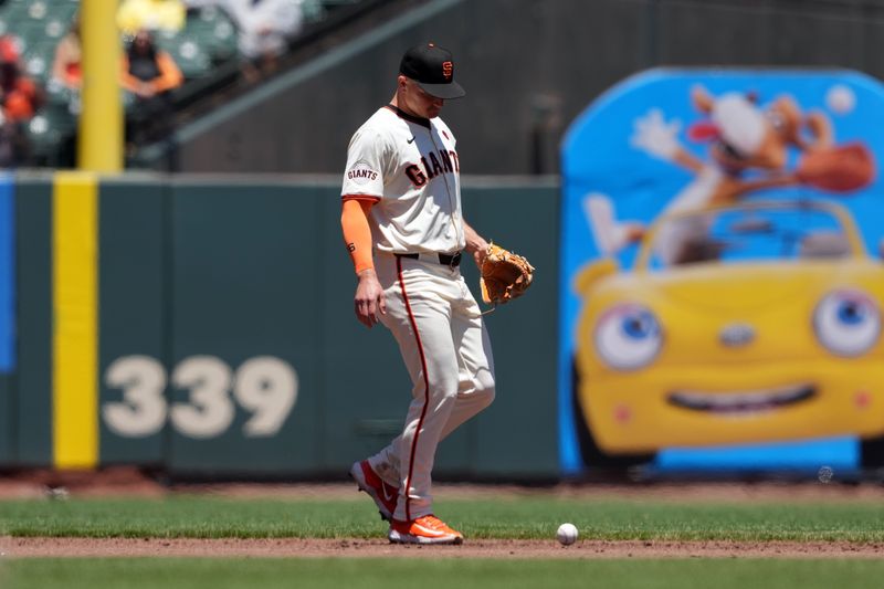 Jun 27, 2024; San Francisco, California, USA; San Francisco Giants third baseman Matt Chapman (26) reacts after committing an error against the Chicago Cubs during the third inning at Oracle Park. Mandatory Credit: Darren Yamashita-USA TODAY Sports