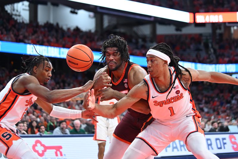 Feb 27, 2024; Syracuse, New York, USA; Syracuse Orange forward Maliq Brown (1) and guard JJ Starling (2) strip the ball from Virginia Tech Hokies forward Mylyjael Poteat in the first half at the JMA Wireless Dome. Mandatory Credit: Mark Konezny-USA TODAY Sports