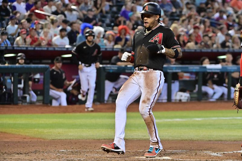 Jul 26, 2023; Phoenix, Arizona, USA;  Arizona Diamondbacks second baseman Ketel Marte (4) scores in the third inning against the St. Louis Cardinals at Chase Field. Mandatory Credit: Matt Kartozian-USA TODAY Sports