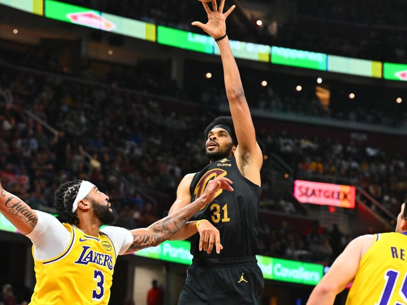 CLEVELAND, OHIO - OCTOBER 30: Dean Wade #32 of the Cleveland Cavaliers shoots over Anthony Davis #3 of the Los Angeles Lakers during the first half at Rocket Mortgage Fieldhouse on October 30, 2024 in Cleveland, Ohio. NOTE TO USER: User expressly acknowledges and agrees that, by downloading and or using this photograph, User is consenting to the terms and conditions of the Getty Images License Agreement. (Photo by Jason Miller/Getty Images)