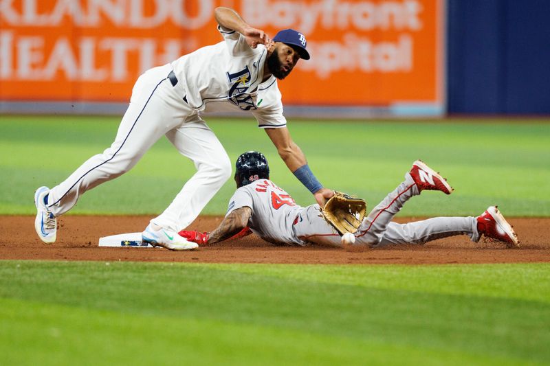 May 21, 2024; St. Petersburg, Florida, USA;  Boston Red Sox outfielder Ceddanne Rafaela (43) steals second base from Tampa Bay Rays shortstop Amed Rosario (10) in the eighth inning at Tropicana Field. Mandatory Credit: Nathan Ray Seebeck-USA TODAY Sports