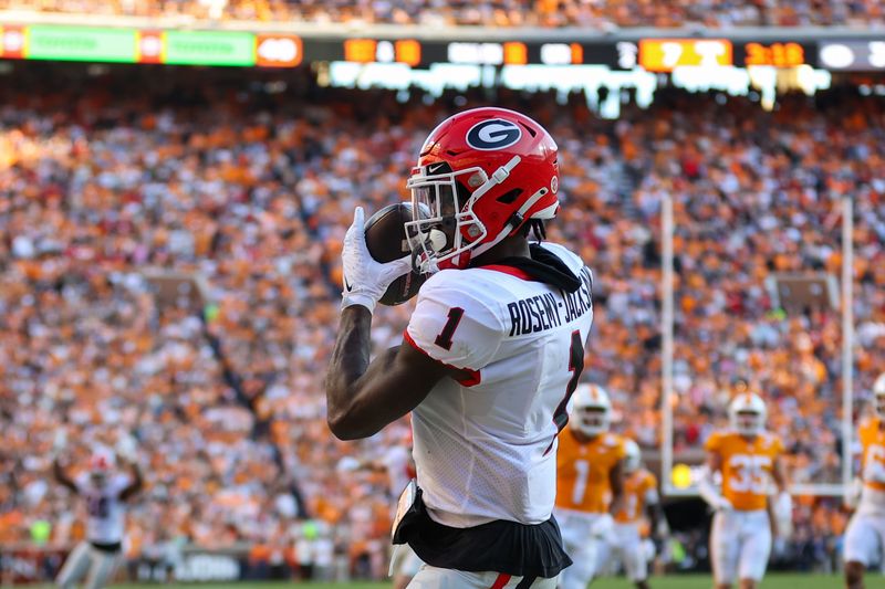 Nov 18, 2023; Knoxville, Tennessee, USA; Georgia Bulldogs wide receiver Marcus Rosemy-Jacksaint (1) catches a pass for a touchdown against the Tennessee Volunteers during the first half at Neyland Stadium. Mandatory Credit: Randy Sartin-USA TODAY Sports