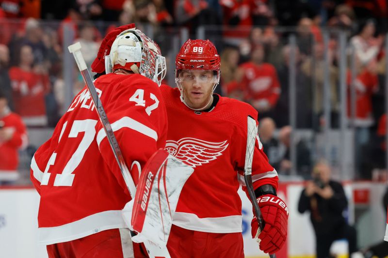 Dec 22, 2023; Detroit, Michigan, USA;  Detroit Red Wings goaltender James Reimer (47) and Detroit Red Wings right wing Patrick Kane (88) celebrate after defeating the Philadelphia Flyers at Little Caesars Arena. Mandatory Credit: Rick Osentoski-USA TODAY Sports