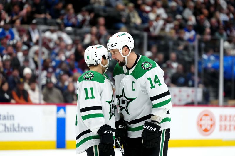 Apr 7, 2024; Denver, Colorado, USA; Dallas Stars center Logan Stankoven (11) and left wing Jamie Benn (14) talk in the third period against the Colorado Avalanche at Ball Arena. Mandatory Credit: Ron Chenoy-USA TODAY Sports