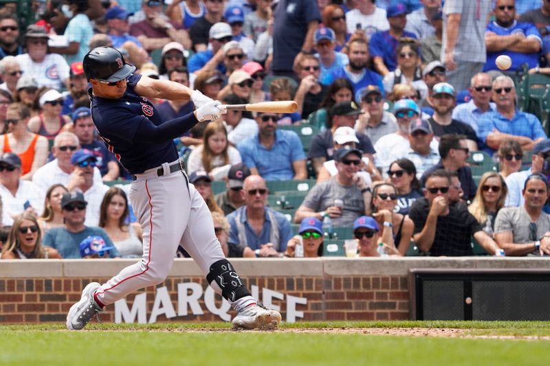 Jul 16, 2023; Chicago, Illinois, USA; Boston Red Sox center fielder Rob Refsnyder (30) hits a single against the Chicago Cubs during the fifth inning at Wrigley Field. Mandatory Credit: David Banks-USA TODAY Sports