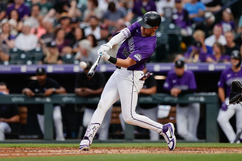 Jun 21, 2024; Denver, Colorado, USA; Colorado Rockies left fielder Nolan Jones (22) hits a solo home run in the fourth inning against the Washington Nationals at Coors Field. Mandatory Credit: Isaiah J. Downing-USA TODAY Sports