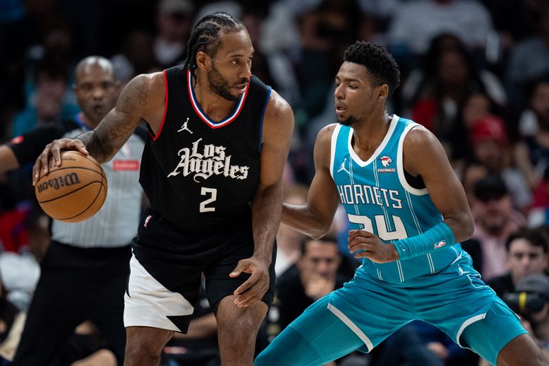 CHARLOTTE, NORTH CAROLINA - MARCH 31: Brandon Miller #24 of the Charlotte Hornets guards Kawhi Leonard #2 of the LA Clippers in the fourth quarter during their game at Spectrum Center on March 31, 2024 in Charlotte, North Carolina. NOTE TO USER: User expressly acknowledges and agrees that, by downloading and or using this photograph, User is consenting to the terms and conditions of the Getty Images License Agreement. (Photo by Jacob Kupferman/Getty Images)