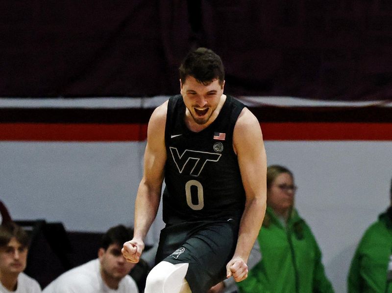 Jan 23, 2024; Blacksburg, Virginia, USA; Virginia Tech Hokies guard Hunter Cattoor (0) celebrates after the Virginia Tech Hokies beat the Boston College Eagles at Cassell Coliseum. Mandatory Credit: Peter Casey-USA TODAY Sports