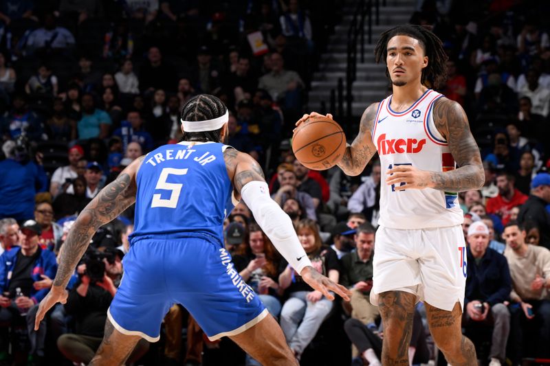 PHILADELPHIA, PA - APRIL 3:  Jalen Hood-Schifino #17 of the Philadelphia 76ers dribbles the ball during the game against the Milwaukee Bucks on April 3, 2025 at the Wells Fargo Center in Philadelphia, Pennsylvania NOTE TO USER: User expressly acknowledges and agrees that, by downloading and/or using this Photograph, user is consenting to the terms and conditions of the Getty Images License Agreement. Mandatory Copyright Notice: Copyright 2025 NBAE (Photo by David Dow/NBAE via Getty Images)