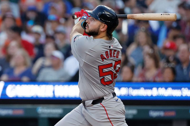 Aug 30, 2024; Detroit, Michigan, USA;  Boston Red Sox outfielder Wilyer Abreu (52) hits a sacrifice fly in the third inning against the Detroit Tigers at Comerica Park. Mandatory Credit: Rick Osentoski-USA TODAY Sports