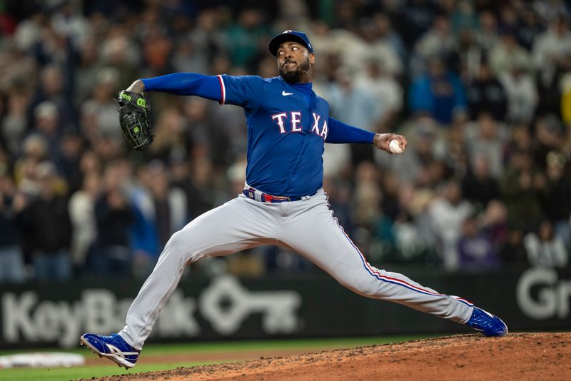 Sep 28, 2023; Seattle, Washington, USA; Texas Rangers reliever Aroldis Chapman (45) delivers a pitch during the ninth inning against the Seattle Mariners at T-Mobile Park. Mandatory Credit: Stephen Brashear-USA TODAY Sports