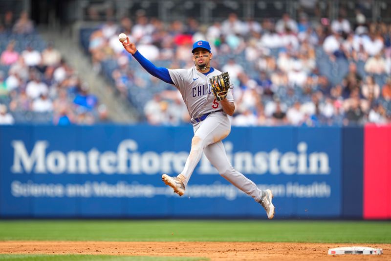 Jul 8, 2023; Bronx, New York, USA; Chicago Cubs second baseman Christopher Morel (5) throws out New York Yankees center fielder Harrison Bader (not pictured) after fielding a ground ball during the eighth inning at Yankee Stadium. Mandatory Credit: Gregory Fisher-USA TODAY Sports