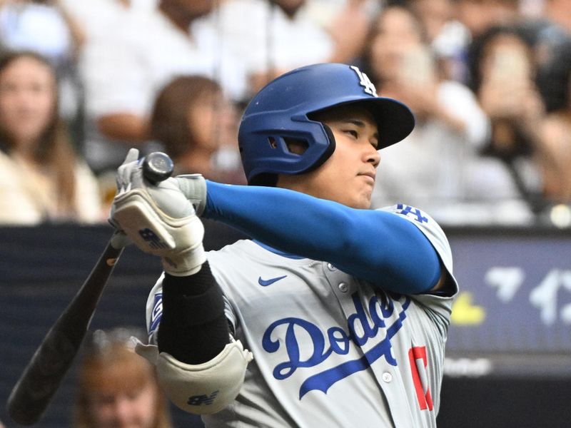 Aug 12, 2024; Milwaukee, Wisconsin, USA; Los Angeles Dodgers two-way player Shohei Ohtani (17) waits to bat in the first innning against the Milwaukee Brewers at American Family Field. Mandatory Credit: Michael McLoone-USA TODAY Sports