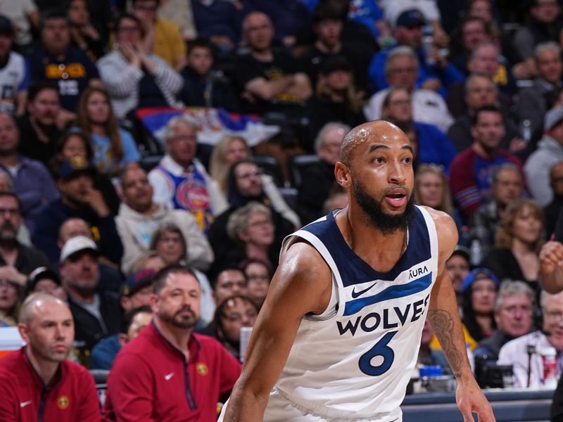 DENVER, CO - APRIL 10: Jordan McLaughlin #6 of the Minnesota Timberwolves dribbles the ball during the game against the Denver Nuggets on April 10, 2024 at the Ball Arena in Denver, Colorado. NOTE TO USER: User expressly acknowledges and agrees that, by downloading and/or using this Photograph, user is consenting to the terms and conditions of the Getty Images License Agreement. Mandatory Copyright Notice: Copyright 2024 NBAE (Photo by Garrett Ellwood/NBAE via Getty Images)