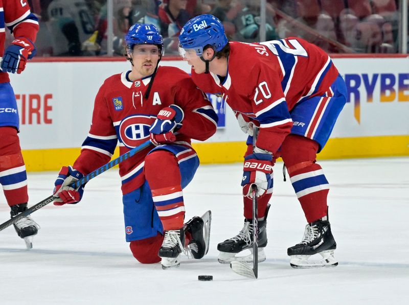 Dec 4, 2023; Montreal, Quebec, CAN; Montreal Canadiens forward Brendan Gallagher (11) and teammate forward Juraj Slafkovsky (20) talk during the warmup period before the game against the Seattle Kraken at the Bell Centre. Mandatory Credit: Eric Bolte-USA TODAY Sports