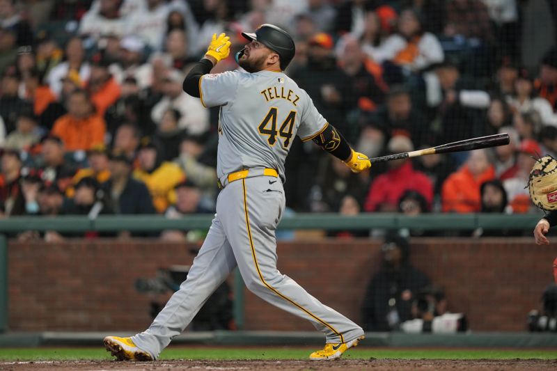 Apr 27, 2024; San Francisco, California, USA; Pittsburgh Pirates first baseman Rowdy Tellez (44) hits an RBI sacrifice fly against the San Francisco Giants during the seventh inning at Oracle Park. Mandatory Credit: Darren Yamashita-USA TODAY Sports