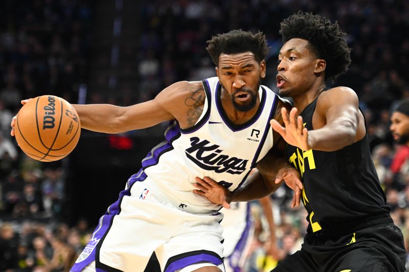 SALT LAKE CITY, UTAH - OCTOBER 29: Malik Monk #0 of the Sacramento Kings drives into Collin Sexton #2 of the Utah Jazz during the first half of a game at Delta Center on October 29, 2024 in Salt Lake City, Utah. NOTE TO USER: User expressly acknowledges and agrees that, by downloading and or using this photograph, User is consenting to the terms and conditions of the Getty Images License Agreement.  (Photo by Alex Goodlett/Getty Images)