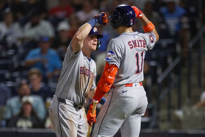 May 19, 2025; Tampa, Florida, USA; Houston Astros center fielder Jake Meyers (6) celebrates with right fielder Cam Smith (11) after hitting a home run against the Tampa Bay Rays in the seventh inning at George M. Steinbrenner Field. Mandatory Credit: Nathan Ray Seebeck-Imagn Images
