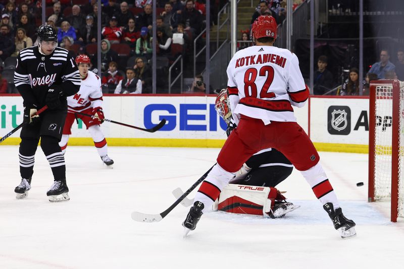 Mar 9, 2024; Newark, New Jersey, USA; Carolina Hurricanes center Martin Necas (88) (not shown) scores a goal on New Jersey Devils goaltender Nico Daws (50) during the first period at Prudential Center. Mandatory Credit: Ed Mulholland-USA TODAY Sports