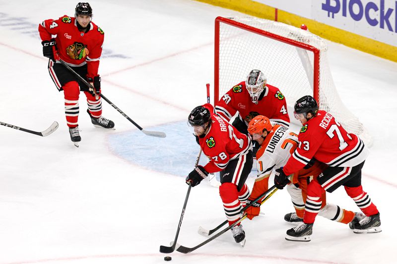 Nov 19, 2024; Chicago, Illinois, USA; Chicago Blackhawks defenseman TJ Brodie (78) defends against the Anaheim Ducks during the first period at United Center. Mandatory Credit: Kamil Krzaczynski-Imagn Images