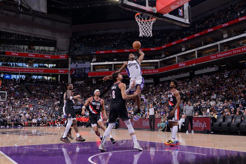 SACRAMENTO, CA - OCTOBER 13: De'Aaron Fox #5 of the Sacramento Kings dunks the ball during the game against the Portland Trail Blazers during a NBA preseason game on October 13, 2024 at Golden 1 Center in Sacramento, California. NOTE TO USER: User expressly acknowledges and agrees that, by downloading and or using this Photograph, user is consenting to the terms and conditions of the Getty Images License Agreement. Mandatory Copyright Notice: Copyright 2024 NBAE (Photo by Rocky Widner/NBAE via Getty Images)