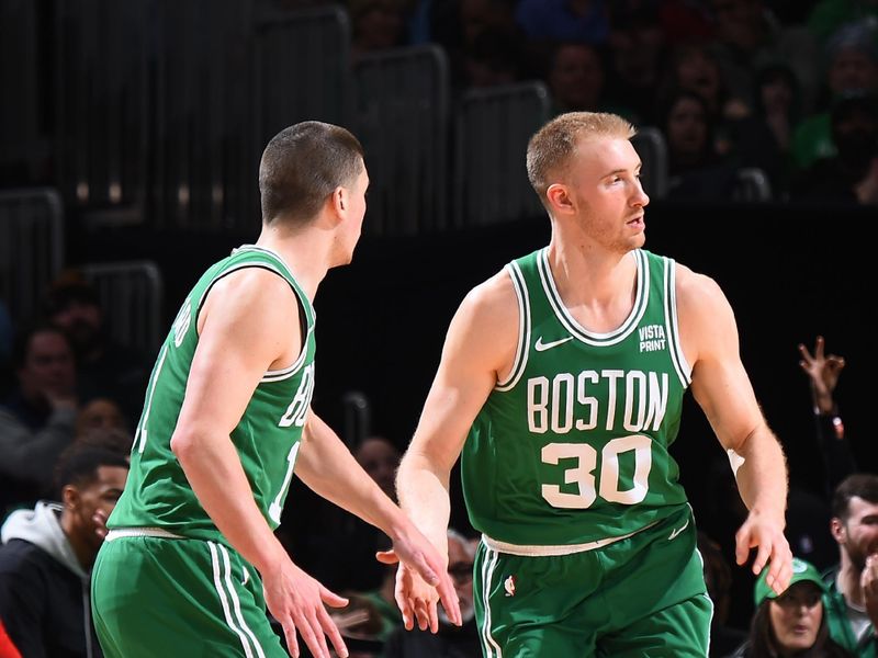 BOSTON, MA - FEBRUARY 7: Payton Pritchard #11 high fives Sam Hauser #30 of the Boston Celtics during the game against the Atlanta Hawks on February 7, 2024 at the TD Garden in Boston, Massachusetts. NOTE TO USER: User expressly acknowledges and agrees that, by downloading and or using this photograph, User is consenting to the terms and conditions of the Getty Images License Agreement. Mandatory Copyright Notice: Copyright 2024 NBAE  (Photo by Brian Babineau/NBAE via Getty Images)