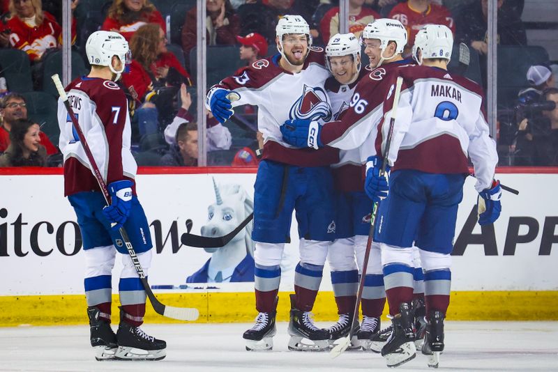 Mar 12, 2024; Calgary, Alberta, CAN; Colorado Avalanche center Nathan MacKinnon (29) celebrates his goal with teammates against the Calgary Flames during the second period at Scotiabank Saddledome. Mandatory Credit: Sergei Belski-USA TODAY Sports