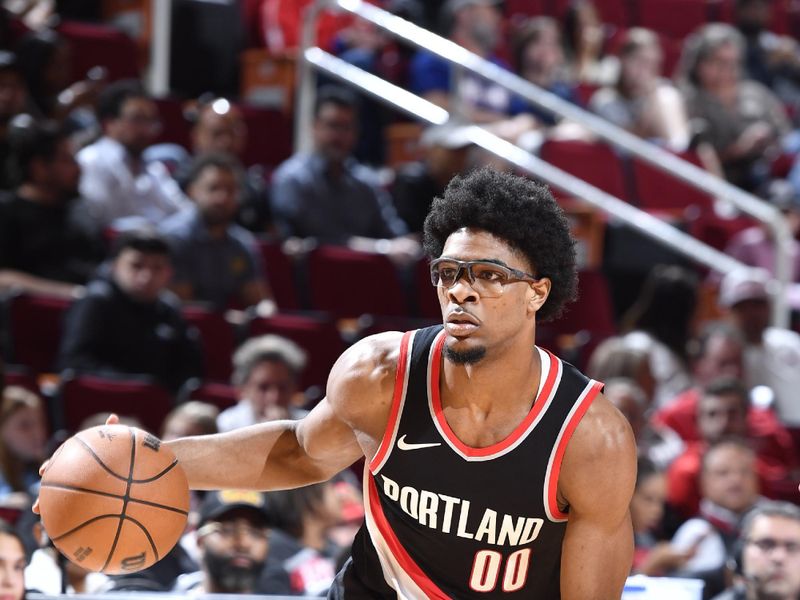 HOUSTON, TX - MARCH 25: Scoot Henderson #00 of the Portland Trail Blazers handles the ball during the game against the Houston Rockets on March 25, 2024 at the Toyota Center in Houston, Texas. NOTE TO USER: User expressly acknowledges and agrees that, by downloading and or using this photograph, User is consenting to the terms and conditions of the Getty Images License Agreement. Mandatory Copyright Notice: Copyright 2024 NBAE (Photo by Logan Riely/NBAE via Getty Images)