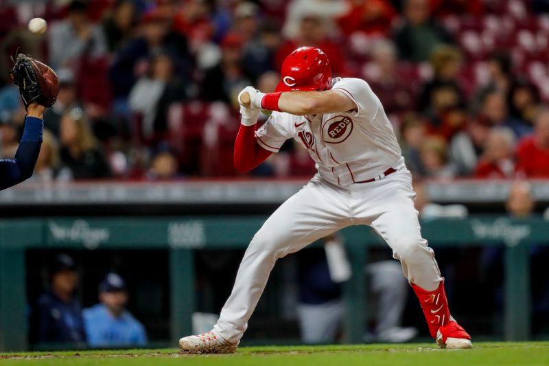 Apr 18, 2023; Cincinnati, Ohio, USA; Cincinnati Reds catcher Curt Casali (12) dodges a wild pitch in the seventh inning against the Tampa Bay Rays at Great American Ball Park. Mandatory Credit: Katie Stratman-USA TODAY Sports