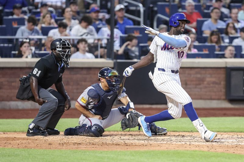 Jun 25, 2025; New York City, New York, USA;  New York Mets second baseman Ronny Mauricio (10) hits a single in the fourth inning against the Atlanta Braves at Citi Field. Mandatory Credit: Wendell Cruz-Imagn Images