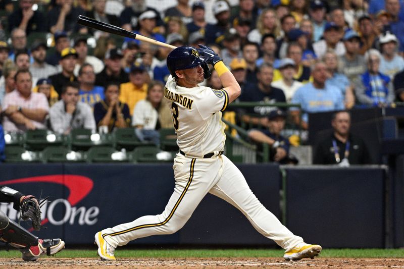 Oct 3, 2023; Milwaukee, Wisconsin, USA; Milwaukee Brewers third baseman Josh Donaldson (3) hits a single in the fifth inning against the Arizona Diamondbacks during game one of the Wildcard series for the 2023 MLB playoffs at American Family Field. Mandatory Credit: Michael McLoone-USA TODAY Sports