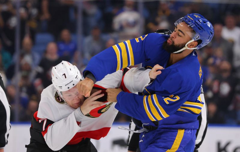 Nov 5, 2024; Buffalo, New York, USA;  Ottawa Senators left wing Brady Tkachuk (7) and Buffalo Sabres left wing Jordan Greenway (12) fight during the first period at KeyBank Center. Mandatory Credit: Timothy T. Ludwig-Imagn Images