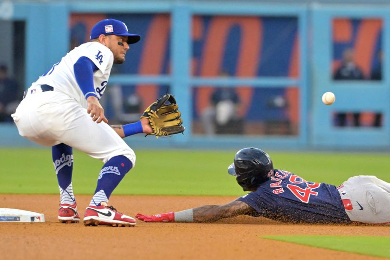 Jul 19, 2024; Los Angeles, California, USA;  Boston Red Sox outfielder Ceddanne Rafaela (43) beats the throw to Los Angeles Dodgers shortstop Miguel Rojas (11) for a stolen base in the third inning at Dodger Stadium. Mandatory Credit: Jayne Kamin-Oncea-USA TODAY Sports