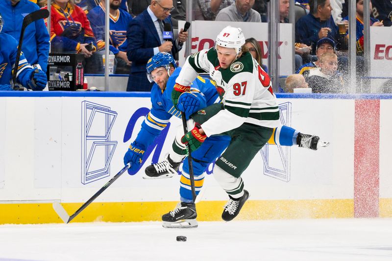 Oct 9, 2025; St. Louis, Missouri, USA; St. Louis Blues left wing Nathan Walker (26) check Minnesota Wild left wing Kirill Kaprizov (97) during the first period at Enterprise Center. Mandatory Credit: Jeff Curry-Imagn Images