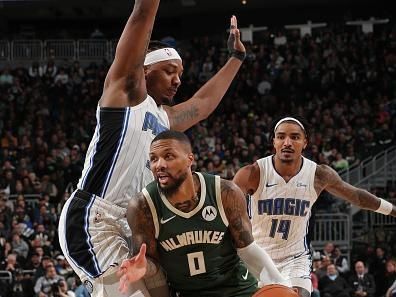 MILWAUKEE, WI - DECEMBER 21:  Damian Lillard #0 of the Milwaukee Bucks handles the ball during the game against the Orlando Magic on December 21, 2023 at the Fiserv Forum Center in Milwaukee, Wisconsin. NOTE TO USER: User expressly acknowledges and agrees that, by downloading and or using this Photograph, user is consenting to the terms and conditions of the Getty Images License Agreement. Mandatory Copyright Notice: Copyright 2023 NBAE (Photo by Gary Dineen/NBAE via Getty Images).