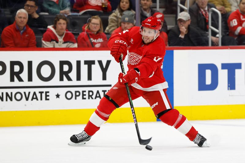 Jan 7, 2025; Detroit, Michigan, USA; Detroit Red Wings right wing Vladimir Tarasenko (11) takes a shot in the second period against the Ottawa Senators at Little Caesars Arena. Mandatory Credit: Rick Osentoski-Imagn Images