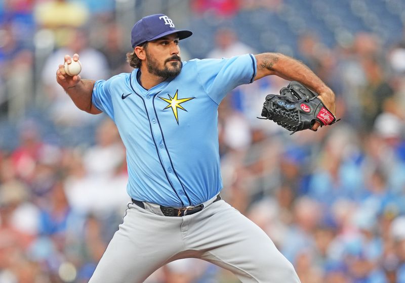 Jul 24, 2024; Toronto, Ontario, CAN; Tampa Bay Rays starting pitcher Zach Eflin (24) throws a pitch against the Toronto Blue Jays during the first inning at Rogers Centre. Mandatory Credit: Nick Turchiaro-USA TODAY Sports