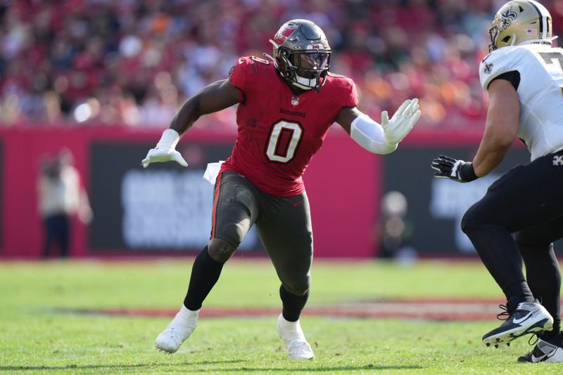 Tampa Bay Buccaneers linebacker Yaya Diaby (0) rushes the passer during an NFL football game against the New Orleans Saints, Sunday, Dec. 31, 2023, in Tampa, Fla. (AP Photo/Peter Joneleit)