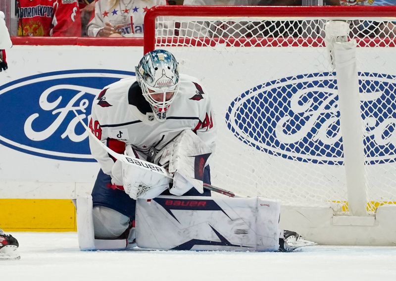 Dec 29, 2025; Sunrise, Florida, USA; Washington Capitals goaltender Logan Thompson (48) makes a save against the Florida Panthers during the second period at Amerant Bank Arena. Mandatory Credit: Jeff Romance-Imagn Images