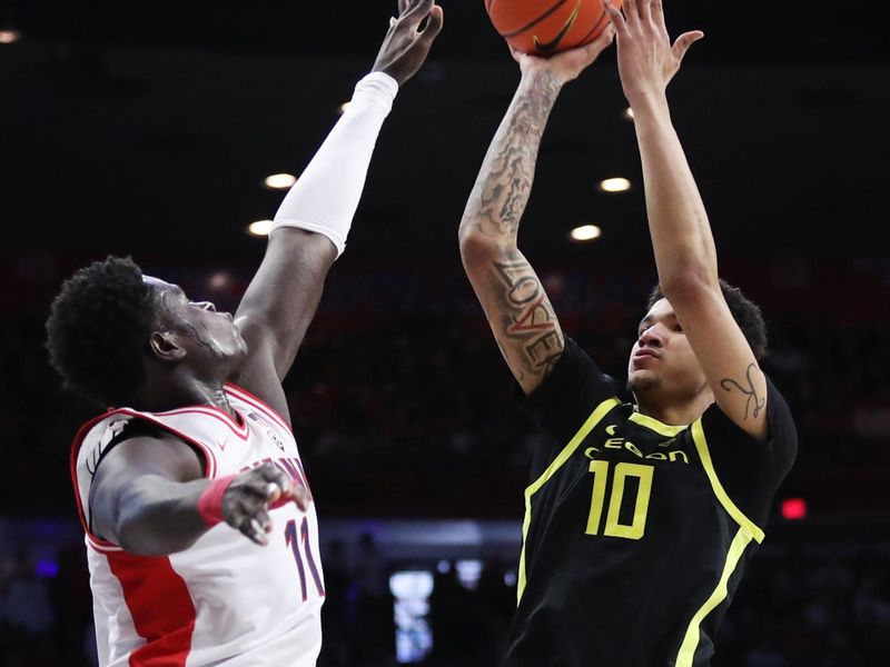 Feb 2, 2023; Tucson, Arizona, USA; Oregon Ducks center Kel'el Ware (10) makes a basket against Arizona Wildcats center Oumar Ballo (11) in the first half at McKale Center. Mandatory Credit: Zachary BonDurant-USA TODAY Sports