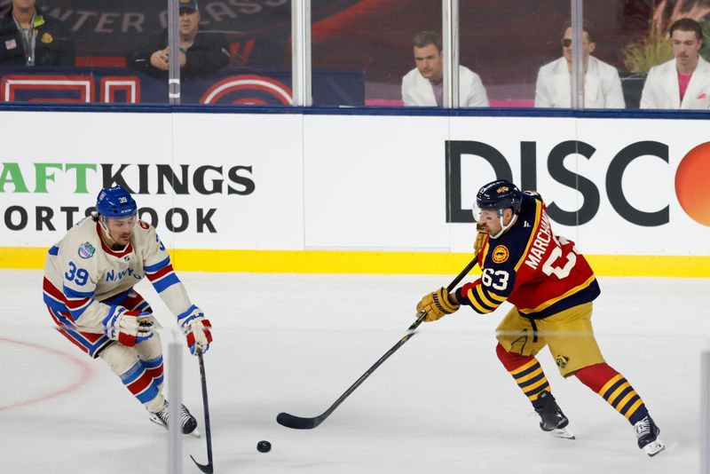 Jan 2, 2026; Miami, Florida, USA; Florida Panthers left wing Brad Marchand (63) passes the puck defended by New York Rangers center Sam Carrick (39) during the second period in the 2026 Winter Classic ice hockey game at loanDepot Park. Mandatory Credit: Rhona Wise-Imagn Images