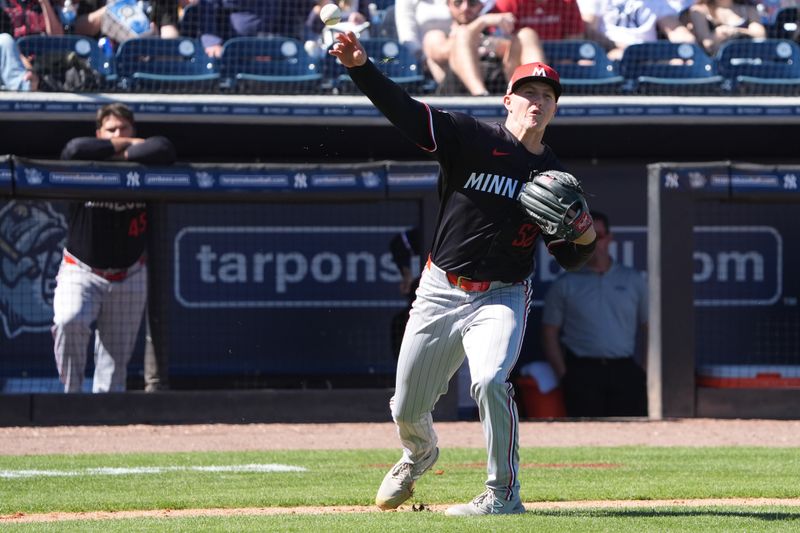 Mar 6, 2025; Tampa, Florida, USA; Minnesota Twins pitcher Zebby Matthews (52) throws out New York Yankees first base Paul Goldschmidt (48) at first base during the fourth inning at George M. Steinbrenner Field. Mandatory Credit: Dave Nelson-Imagn Images