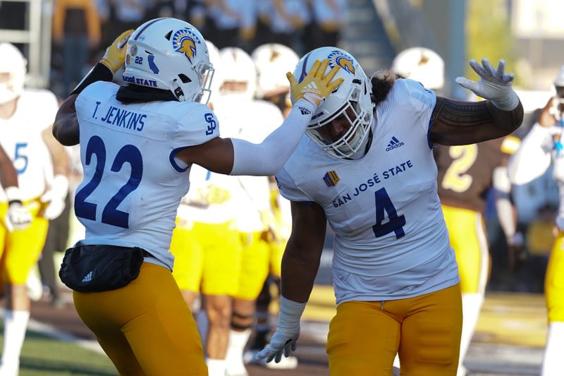 Oct 1, 2022; Laramie, Wyoming, USA; San Jose State Spartans defensive lineman Noah Wright (4) celebrates a safety against the Wyoming Cowboys during the first quarter at Jonah Field at War Memorial Stadium. Mandatory Credit: Troy Babbitt-USA TODAY Sports