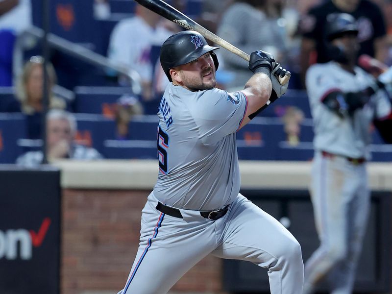 Jun 13, 2024; New York City, New York, USA; Miami Marlins third baseman Jake Burger (36) follows through on a solo home run against the New York Mets during the sixth inning at Citi Field. Mandatory Credit: Brad Penner-USA TODAY Sports